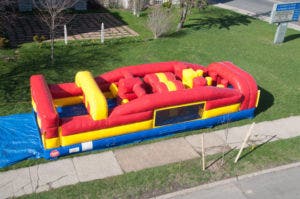 Water Bounce House slide by Tent and Table
