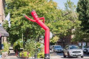 Big tall green monster that looks like inflatable tube man with