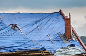 blue tarp used by a roofer