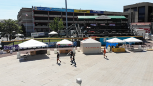 A line of party tents set up on the same baseball field where the Buffalo Bisons play