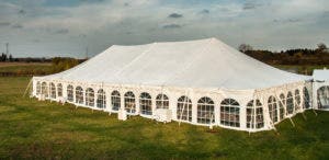 a large outdoor party tent, complete with sidewalls and outdoor heaters