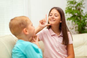 American Sign Language (ASL) and Pidgin Signed English (PSE) are both acceptable forms of sign language throughout the United States