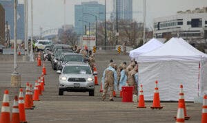 A drive thru screening tent allows healthcare workers to administer testing in a quick deploy environment.