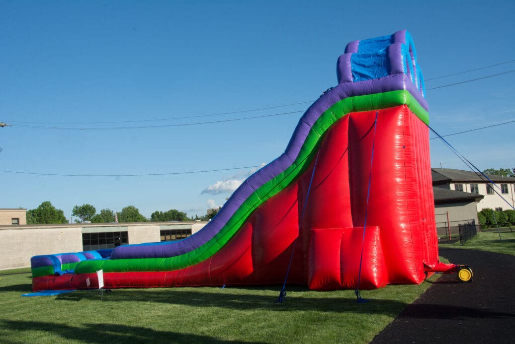 Inflatable bounce house featured at St.Gregs by Tent and Table