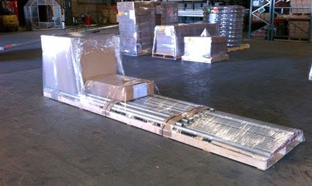 Packed equipment ready to ship by Tent and Table